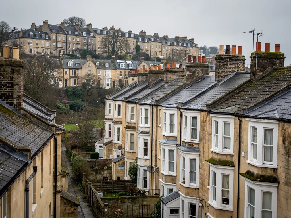 Bristol Victorian terraced houses with slate roofs and bay windows on a hill